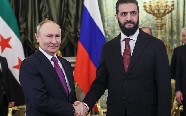 Russian President Vladimir Putin (left) and Syrian interim President Ahmed al-Sharaa pose for a photo during their meeting at the Grand Kremlin Palace in Moscow on January 28, 2026. (Maxim Shipenkov/Pool Photo via AP)