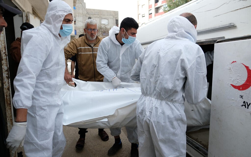 Bodies of Palestinians returned on Thursday from Israel as part of the ceasefire deal are carried after being examined at Shifa Hospital, in Gaza City, January 30, 2026. (AP Photo/Jehad Alshrafi)