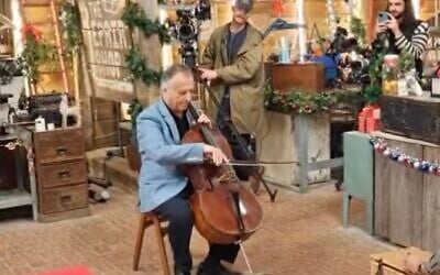 Screen capture from video of British Jewish cellist Raphael Wallfisch playing a Holocaust-era cello in BBC show 'The Repair Shop' in December 2025. (Instagram; used in accordance with Clause 27a of the Copyright Law)