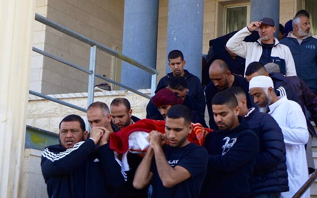 Pallbearers carry the coffin of Muhammad Hussein Tarabin, who was shot and killed by police in his home, during his funeral procession on January 5, 2026. (Charlie Summers/Times of Israel)