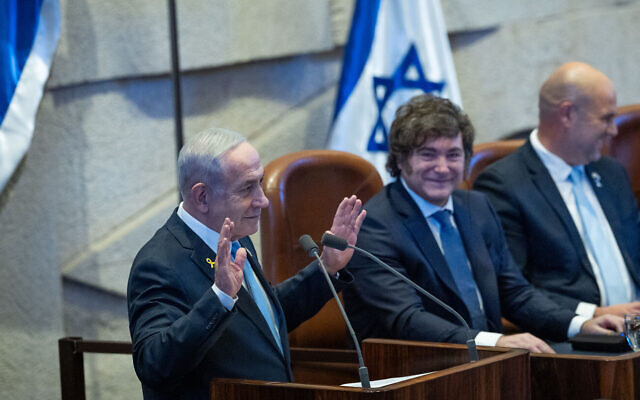Prime Minister Benjamin Netanyahu speaks to the Knesset as Argentinian President Javier Milei looks on in Jerusalem, June 11, 2025. (Yonatan Sindel/Flash90) Prime Minister Benjamin Netanyahu speaks to the Knesset as Argentinian President Javier Milei looks on in Jerusalem, June 11, 2025. (Yonatan Sindel/Flash90)
