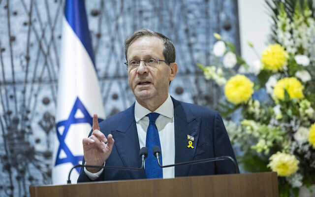 President Isaac Herzog speaks during a ceremony marking the lighting of the first Hanukkah candle at the President’s Residence in Jerusalem, on December 14, 2025. (Chaim Goldberg/Flash90)