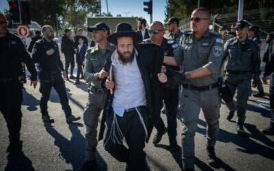 Ultra-Orthodox Jews protest against Haredi conscription outside the IDF Recruitment Center at Tel Hashomer, January 4, 2026. (Erik Marmor/Flash90)