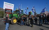 Dairy farmers and their supporters protest against the milk reform led by Finance Minister Bezalel Smotrich at HaGoma Junction near the city of Kiryat Shmona, northern Israel, January 5, 2026. (Ayal Margolin/Flash90)