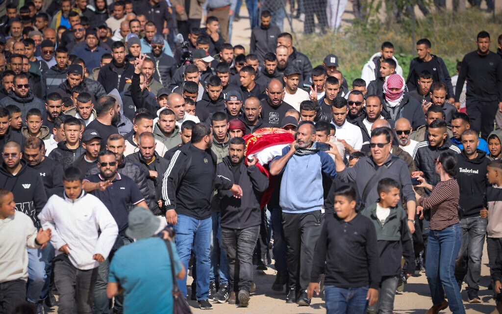 Family members and friends attend the funeral of Muhammad Hussein Tarabin, who was shot and killed by a police officer several days ago, in the village of Tarabin in the Negev, January 5, 2026. (Jamal Awad/Flash90)