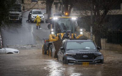 Heavy flooding in a road in the village of Abu Ghosh, outside Jerusalem, January 13, 2026. (Oren Ben Hakoon/Flash90)