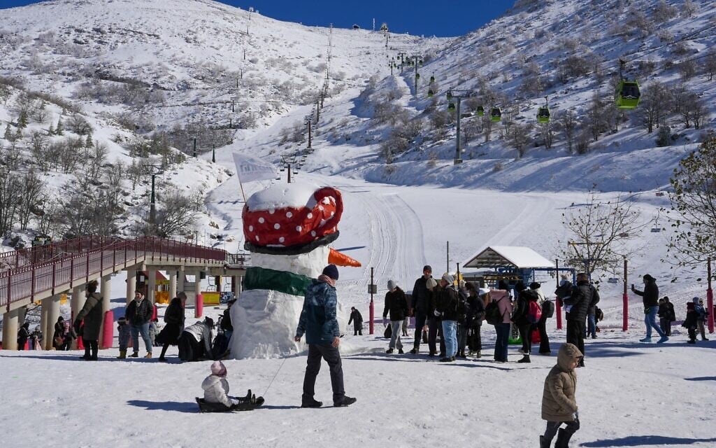 Israelis enjoy the snow on Mount Hermon, January 15, 2026. (Ayal Margolin/Flash90)
