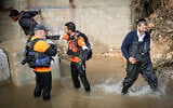 Rescue forces search for a missing man who was caught in the Nahal Modi'in stream during a storm near the settlement of Modi’in Illit, January 15, 2026. (Jonathan Shaul/Flash90)