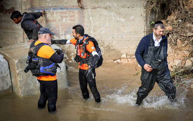 Rescue forces search for a missing man who was caught in the Nahal Modi'in stream during a storm near the settlement of Modi’in Illit, January 15, 2026. (Jonathan Shaul/Flash90) Rescue forces search for a missing man who was caught in the Nahal Modi'in stream during a storm near the settlement of Modi’in Illit, January 15, 2026. (Jonathan Shaul/Flash90)