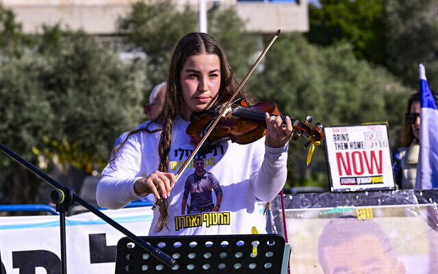 Former hostage Agam Berger at a Shabbat service at Hostages Square in Tel Aviv calling for the return of Master Sgt. Ran Gvili, whose body remains in Gaza, on January 16, 2026 (Avshalom Sassoni/Flash90) Former hostage Agam Berger at a Shabbat service at Hostages Square in Tel Aviv calling for the return of Master Sgt. Ran Gvili, whose body remains in Gaza, on January 16, 2026 (Avshalom Sassoni/Flash90)