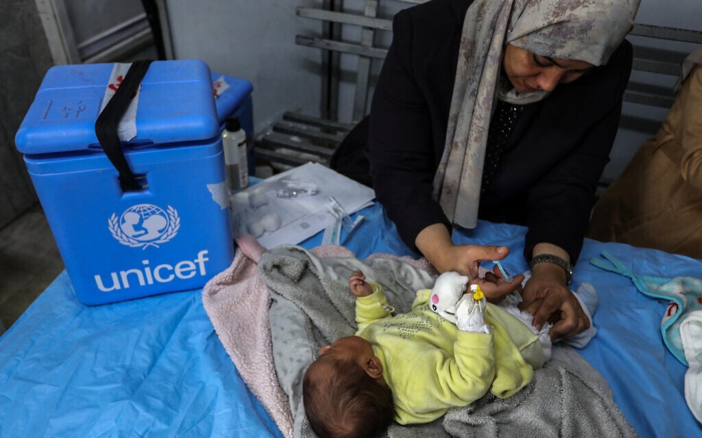 Palestinian children receive vaccinations at the Nasser Hospital in the Gaza Strip, as part of a catch-up immunization campaign on January 18, 2026 (Abed Rahim Khatib/Flash90)
