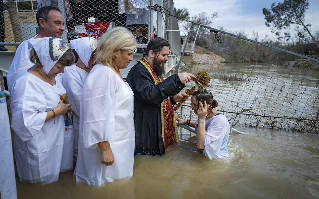 Worshippers take part in a traditional baptism ceremony on the Christian holiday of Epiphany at Qasr el Yahud, the site where Jesus is traditionally believed to have been baptized, near the West Bank town of Jericho, January 18, 2026. (Erik Marmor/Flash90)