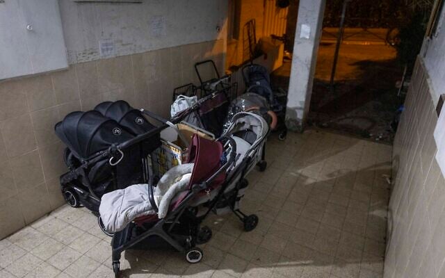 Strollers outside the building where two babies died and dozens of others were injured in an unlicensed private daycare in Jerusalem, January 19, 2026. (Chaim Goldberg/Flash90) Strollers outside the building where two babies died and dozens of others were injured in an unlicensed private daycare in Jerusalem, January 19, 2026. (Chaim Goldberg/Flash90)