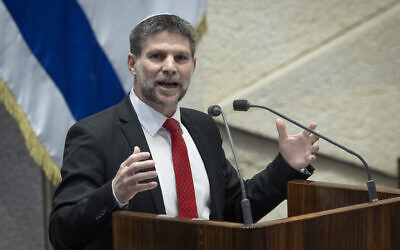 Finance Minister Bezalel Smotrich addresses lawmakers ahead of the first reading of the 2026 state budget, January 28, 2026. (Oren Ben Hakoon/Flash90)