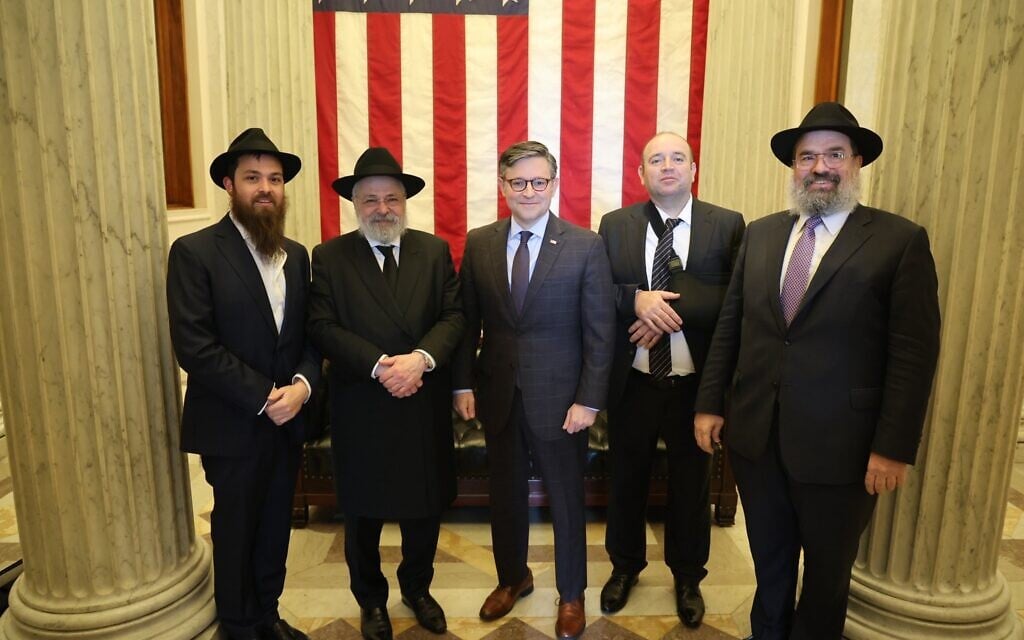 Ahmed Al-Ahmed (second from right), the man who disarmed a shooter during the Bondi beach terror attack in December 2025, poses with US Speaker of the House Mike Johnson (center) and Chabad rabbis at the US Capitol on January 8, 2026. (Mike Johnson/X)