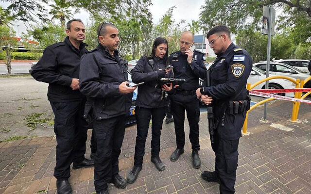 Police officers at the scene of an incident in which a fellow officer was set on fire at a gas station in Kiryat Bialik, northern Israel, on January 22, 2026. (Israel Police) Police officers at the scene of an incident in which a fellow officer was set on fire at a gas station in Kiryat Bialik, northern Israel, on January 22, 2026. (Israel Police)