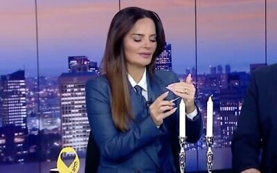 The Israeli TV host Ofira Asayag (L) is secular but lit Shabbat candles on air in 2024, during the Israel Hamas war — reflecting a trend among Israelis. (Screenshot via JTA)