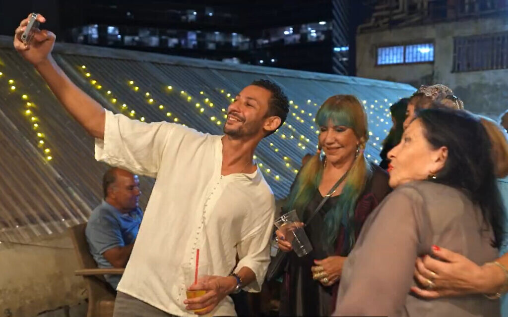 Yona Elfassi (L), founder of Limud Darija, with students at an event, in a video published on October 25, 2023. (YouTube screenshot/Limud Darija) Yona Elfassi (L), founder of Limud Darija, with students at an event, in a video published on October 25, 2023. (YouTube screenshot/Limud Darija)