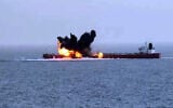 A handout picture obtained from Yemen's Houthi Ansarullah Media Center shows what they say is their targeting of CHIOS LION, a Liberia-flagged crude oil tanker, by unmanned surface vessels in the Red Sea on July 15, 2024. (ANSARULLAH MEDIA CENTRE / AFP)