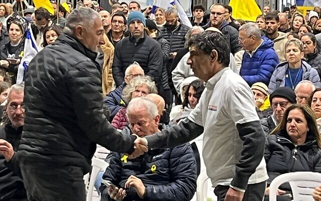 Itzik Gvili, father of slain hostage Ran Gvili, shakes hands with Simcha Goldin on January 3, 2026, in Meitar. (Courtesy of Hostages Forum) Itzik Gvili, father of slain hostage Ran Gvili, shakes hands with Simcha Goldin on January 3, 2026, in Meitar. (Courtesy of Hostages Forum)