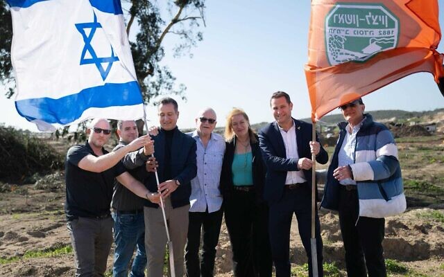 Members of Rishon LeZion’s city council and municipality leadership attend a ceremony commemorating the completion of the first phase of the unexploded ordnance clearance of “Firing Range 24,” January 12, 2026. (Defense Ministry)