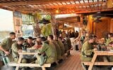 Soldiers enjoy free meals at Shuva Achim, near the Gaza border, southern Israel, January 5, 2026. (Dror Trabelsi)