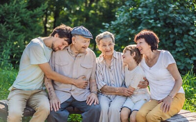 Four generations of family spend time together in the park. (iStock)