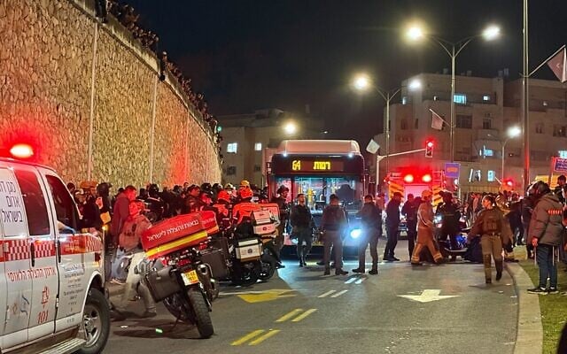 First responders surround a bus that ran over Haredi protesters in Jerusalem, January 6, 2026. (Sam Sokol/Times of Israel)