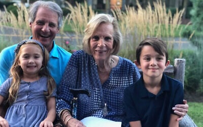Elaine Grossinger Etess (second from right) with son Mitchell Grossinger Etess (left) and great-grandchildren Ashley and Mark Etess, grandchildren of the late Mark Etess. (Courtesy Grossinger Etess family via JTA)