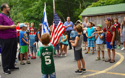 Scott Sokol, head of school at MetroWest Jewish Day School in Framingham, Massachusetts, leading morning circle, in 2019.  (Courtesy of MWJDS via JTA)