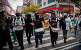 Anti-Israel activists in New York City, October 7, 2024. (Luke Tress/Times of Israel)
