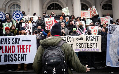 Activists protest against New York City legislation meant to protect houses of worship, at City Hall in New York City, February 25, 2026. (Luke Tress/Times of Israel