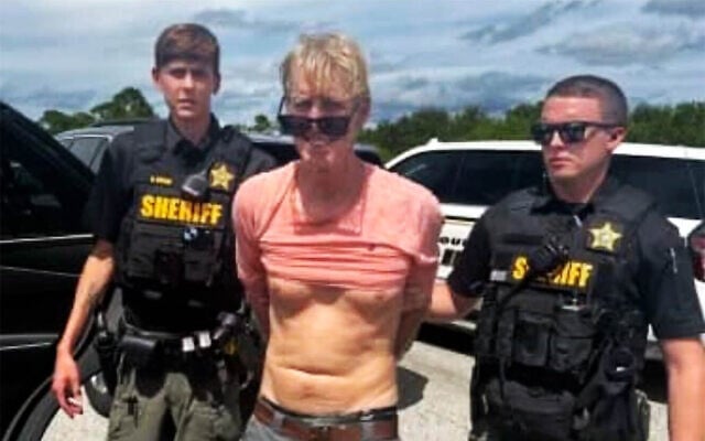 Law enforcement officers arrest Ryan Routh, the man suspected in the apparent assassination attempt of Donald Trump, in Martin County, Florida, September 15, 2024. (Martin County Sheriff’s Office via AP) Law enforcement officers arrest Ryan Routh, the man suspected in the apparent assassination attempt of Donald Trump, in Martin County, Florida, September 15, 2024. (Martin County Sheriff’s Office via AP)