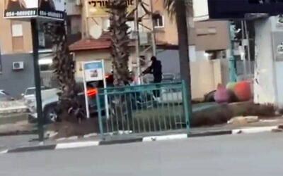 The perpetrator of a fatal shooting in Lod is seen on video before shooting three men in a car, killing one, on January 31, 2026. (Screenshot/X)