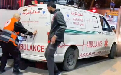Emergency staff react as an ambulance pulls up at the Rafidia Surgical Hospital in Nablus, in the northern West Bank, carrying a person reportedly wounded by IDF gunfire in the village of Beit Furik, February 21, 2026. (Screen capture: X/Quds News Network)