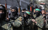 Masked Hamas gunmen attend the funeral of Mahmoud al-Nabaheen, 24, in the Bureij refugee camp, in the central Gaza Strip, on January 23, 2019. (MAHMUD HAMS / AFP)