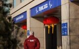 This handout photo taken and received from the OIS/IOC on March 3, 2022, shows a neutral athlete outside the Paralympic Village in Beijing, China. (Chloe KNOTT / OIS/IOC / AFP)