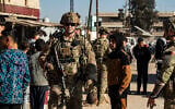US soldiers patrol in Syria's northeastern city Qamishli, in the Hasakeh province, then mostly controlled by Kurdish-led Syrian Democratic Forces (SDF), on January 9, 2025. (Delil SOULEIMAN / AFP)