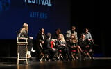 From left to right: Meghan Leathers, Jon Bass, Theo Taplitz, Kyra Sedgwick, Method Man, Milana Vayntrub, Adam Mitchell, and Daniel Robbins speak onstage during the 25th Atlanta Jewish Film Festival 'Bad Shabbos' opening night premiere at Cobb Energy Performing Arts Center on February 19, 2025, in Atlanta, Georgia. (Derek White/ AFP)