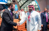 This handout picture provided by the Saudi Press Agency (SPA) shows Syria's interim President Ahmed al-Sharaa (L) being welcomed by Saudi Crown Prince Mohammed bin Salman, as Donald Trump Jr. (R) looks on during the Future Investment Initiative (FII) conference in Riyadh on October 29, 2025. (SAUDI PRESS AGENCY SPA / AFP)
