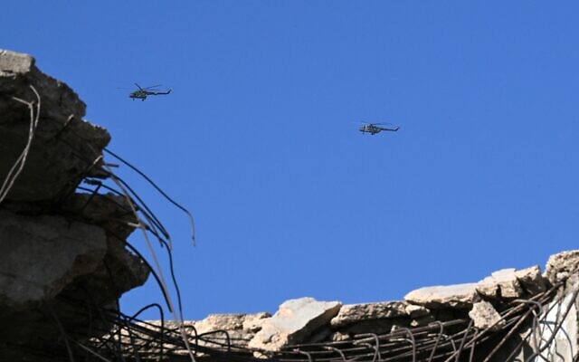 Syrian army helicopters hover near Mezzeh military airport in Damascus on November 10, 2025. (LOUAI BESHARA / AFP) Syrian army helicopters hover near Mezzeh military airport in Damascus on November 10, 2025. (LOUAI BESHARA / AFP)