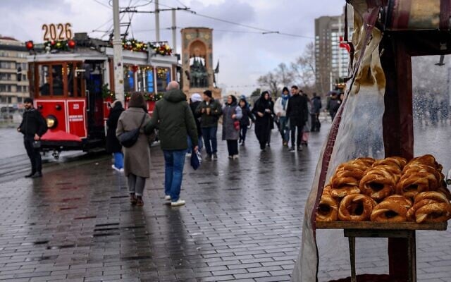 A street vendor sells traditional Turkish bagels "Simit" as he waits for customers at Taksim Square, in Istanbul, on December 27, 2025. (Yasin Akgul/AFP) A street vendor sells traditional Turkish bagels "Simit" as he waits for customers at Taksim Square, in Istanbul, on December 27, 2025. (Yasin Akgul/AFP)