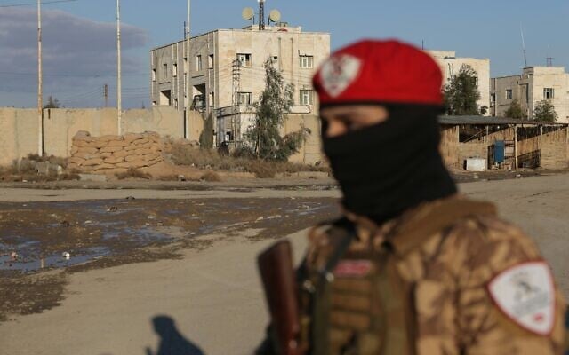 A Syrian government soldier stands outside SDF controlled Al Aktan prison which holds ISIS detainees, as the Syrian amry takes possession of the nearby SDF military base in the city of Raqa on January 19, 2026. After two days of rapid gains in Kurdish-controlled territory, the Syrian president announced on January 18, a deal with the chief of the Kurdish-led Syrian Democratic Forces (SDF) that includes a ceasefire and the integration of the Kurdish administration and forces into the central state. (Photo by Bakr ALkasem / AFP) A Syrian government soldier stands outside SDF controlled Al Aktan prison which holds ISIS detainees, as the Syrian amry takes possession of the nearby SDF military base in the city of Raqa on January 19, 2026. After two days of rapid gains in Kurdish-controlled territory, the Syrian president announced on January 18, a deal with the chief of the Kurdish-led Syrian Democratic Forces (SDF) that includes a ceasefire and the integration of the Kurdish administration and forces into the central state. (Photo by Bakr ALkasem / AFP)