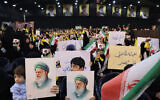 Hezbollah supporters hold portraits of Iran's Supreme Leader Ayatollah Ali Khamenei during a rally to show their solidarity with Iran, in the southern suburb of Beirut on January 26, 2026. (Anwar AMRO / AFP)