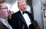 US President Donald Trump speaks to members of the media aboard Air Force One as he travels from Washington, DC, to West Palm Beach, Florida, on January 31, 2026. (SAUL LOEB / AFP)