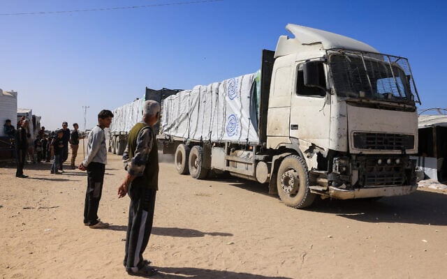 Palestinians look on as trucks carrying humanitarian aid arrive in Khan Younis in the southern Gaza Strip on February 1, 2026. (Bashar Taleb / AFP) Palestinians look on as trucks carrying humanitarian aid arrive in Khan Younis in the southern Gaza Strip on February 1, 2026. (Bashar Taleb / AFP)
