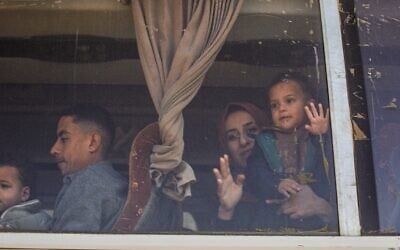 A Palestinian child looks out of a bus window transporting patients and war-wounded, as it heads towards the Rafah crossing to leave the Gaza Strip for treatment abroad, in Khan Younis in the southern Gaza Strip, on February 2, 2026. (Bashar Taleb / AFP)