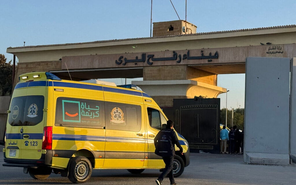 Ambulances wait in line at the Egyptian side of the Rafah border crossing with the Gaza Strip on February 2, 2026 (AFP)