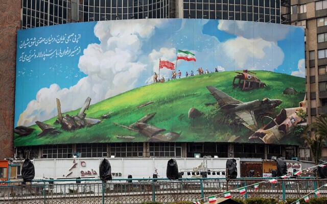 A photograph shows an anti-US billboard displayed on a building in Tehran's Valiasr Square on February 4, 2026. (AFP)