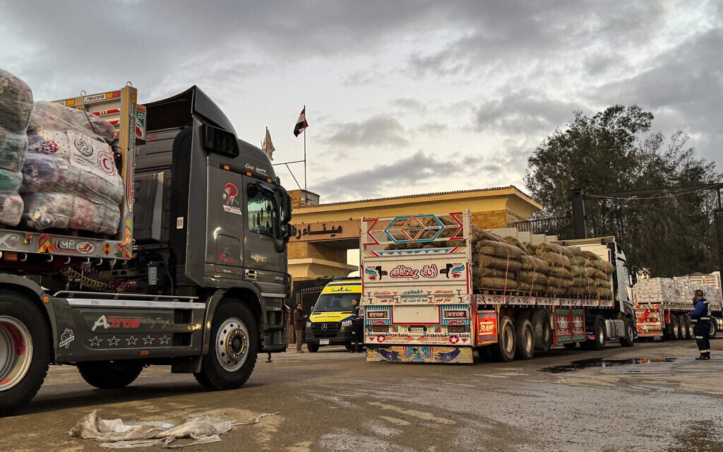 Humanitarian aid trucks enter through the Egyptian side of the Rafah border crossing with the Gaza Strip on February 4, 2026, days after Israel permitted a limited reopening of the border post. (AFP)